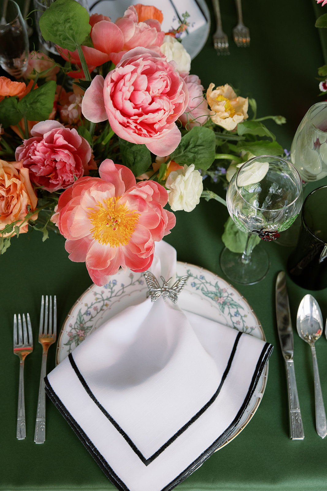 bold pink floral centerpieces, insect napkin rings. Spring, private home tented wedding in south carolina. Sarah Bradshaw Photography