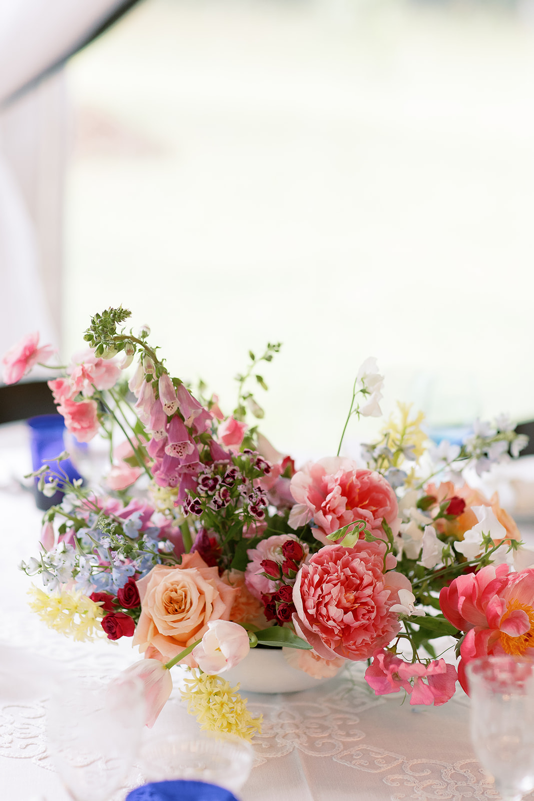colorful, organic floral centerpiece. whimsy, wild. Spring, private home tented wedding in south carolina. Sarah Bradshaw Photography