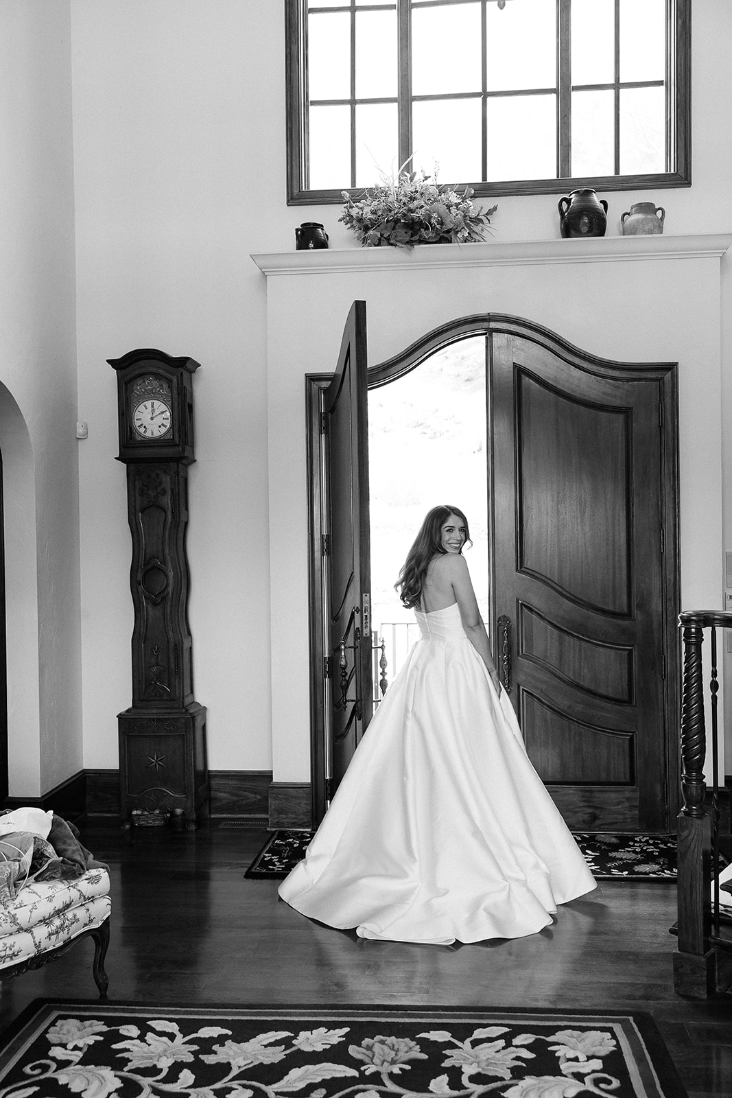 bride in strapless ball gown about to walk outside. elegant spring wedding south carolina. sarah bradshaw photography