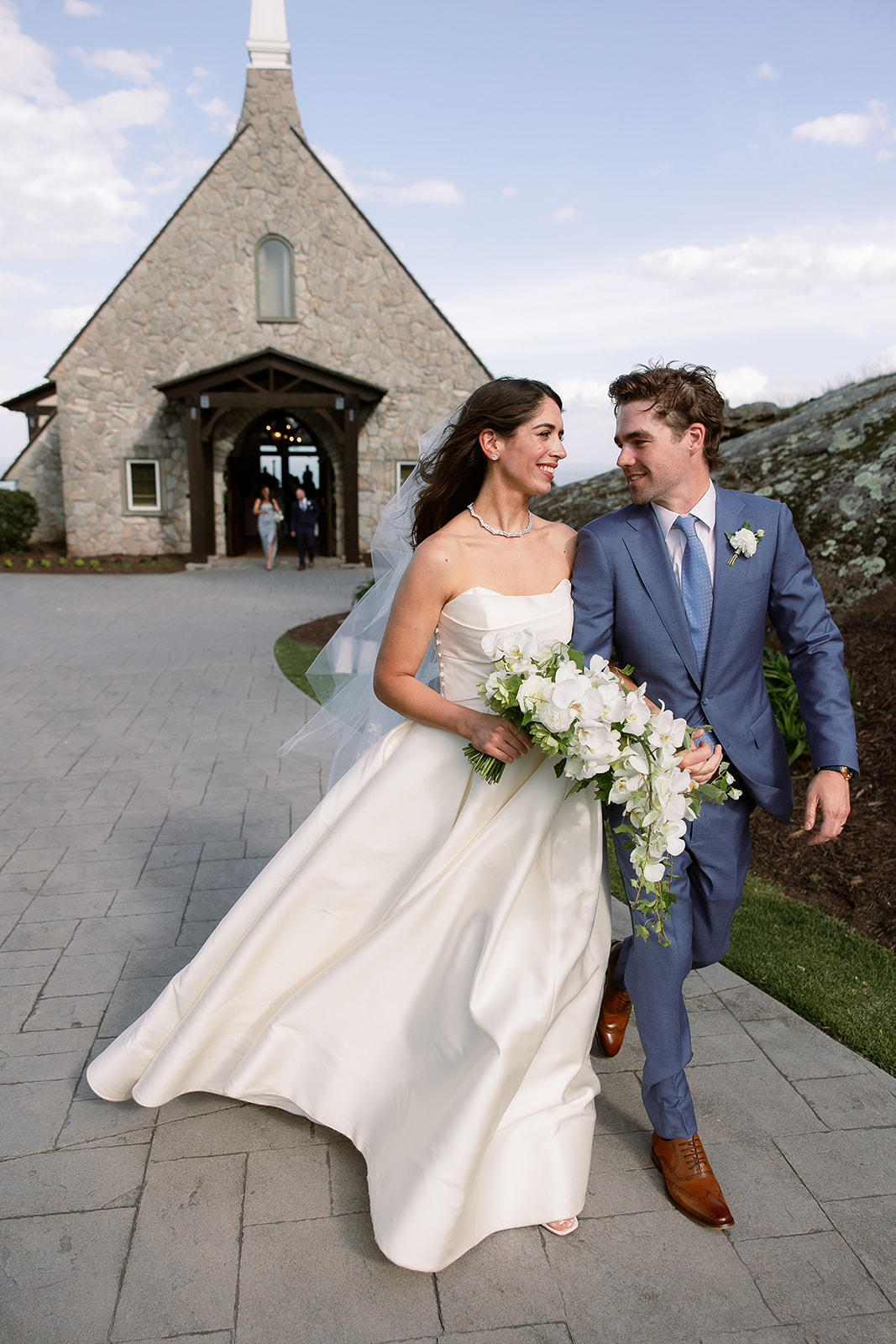 bride and groom leaving wedding chapel. elegant south carolina spring wedding. sarah bradshaw photography