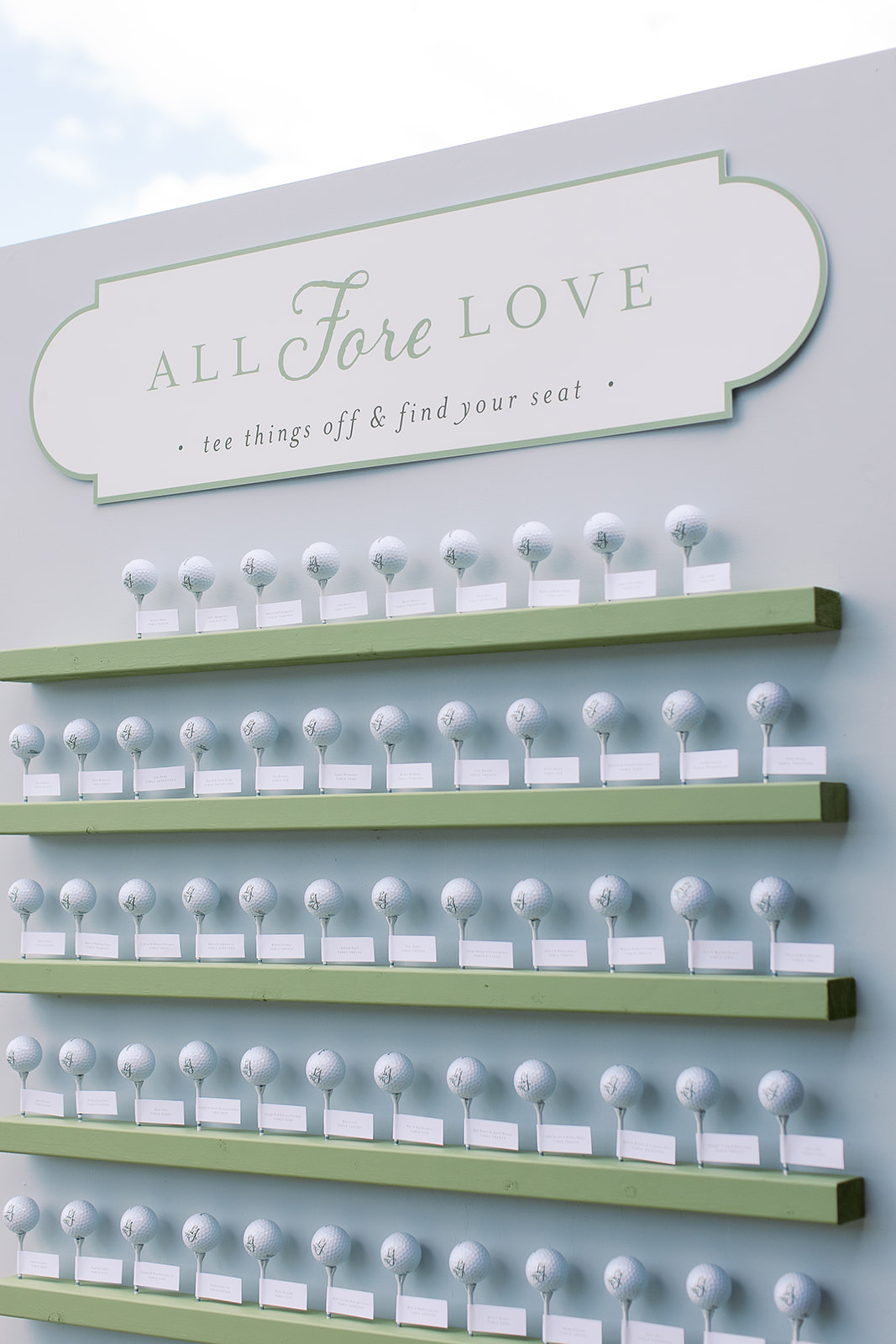 creative golf themed wedding escort card display with golf balls on tees. elegant south carolina spring wedding. sarah bradshaw photography