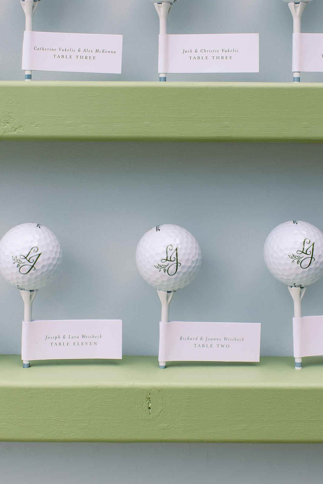 Monogrammed golf balls on tees as wedding escort cards. elegant south carolina spring wedding. sarah bradshaw photography