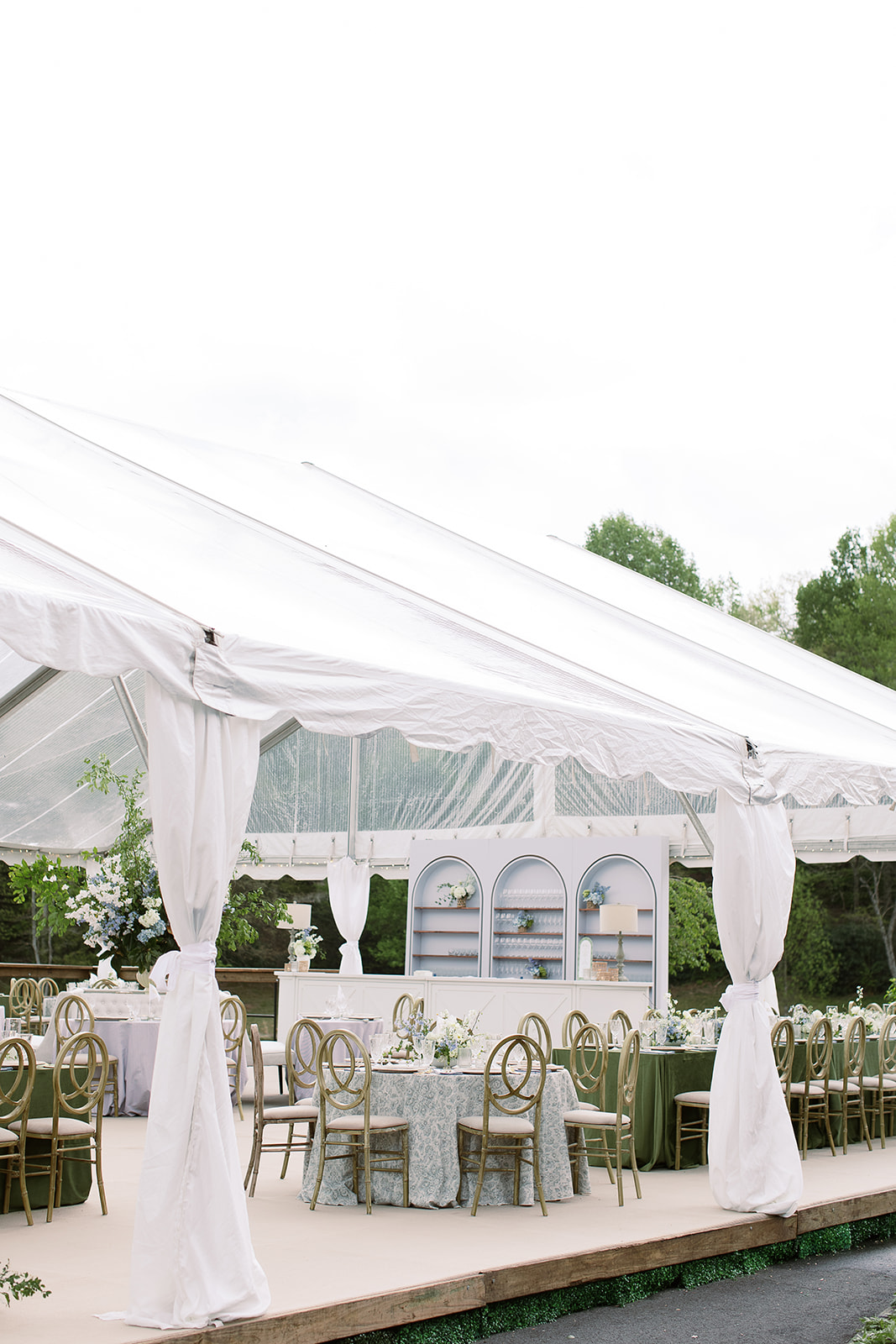 Chic tented wedding reception space, cream and pastel blue and green color palette. elegant south carolina spring wedding. sarah bradshaw photography