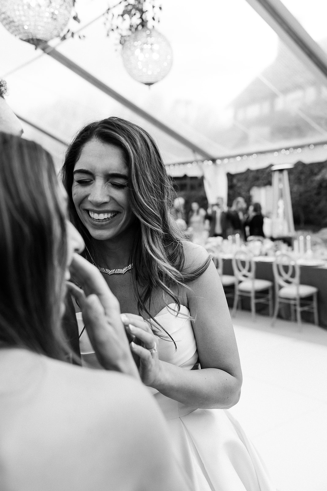 bride laughing with bridesmaids. candid portrait. elegant south carolina spring wedding. sarah bradshaw photography