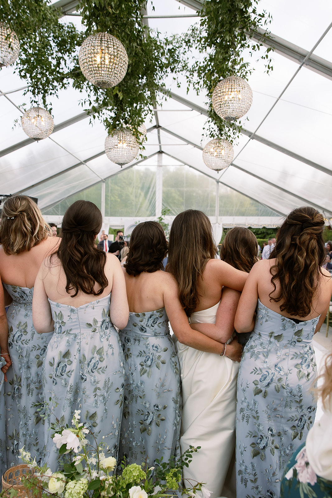 bridesmaids hugging bride during wedding reception dancing. elegant south carolina spring wedding. sarah bradshaw photography