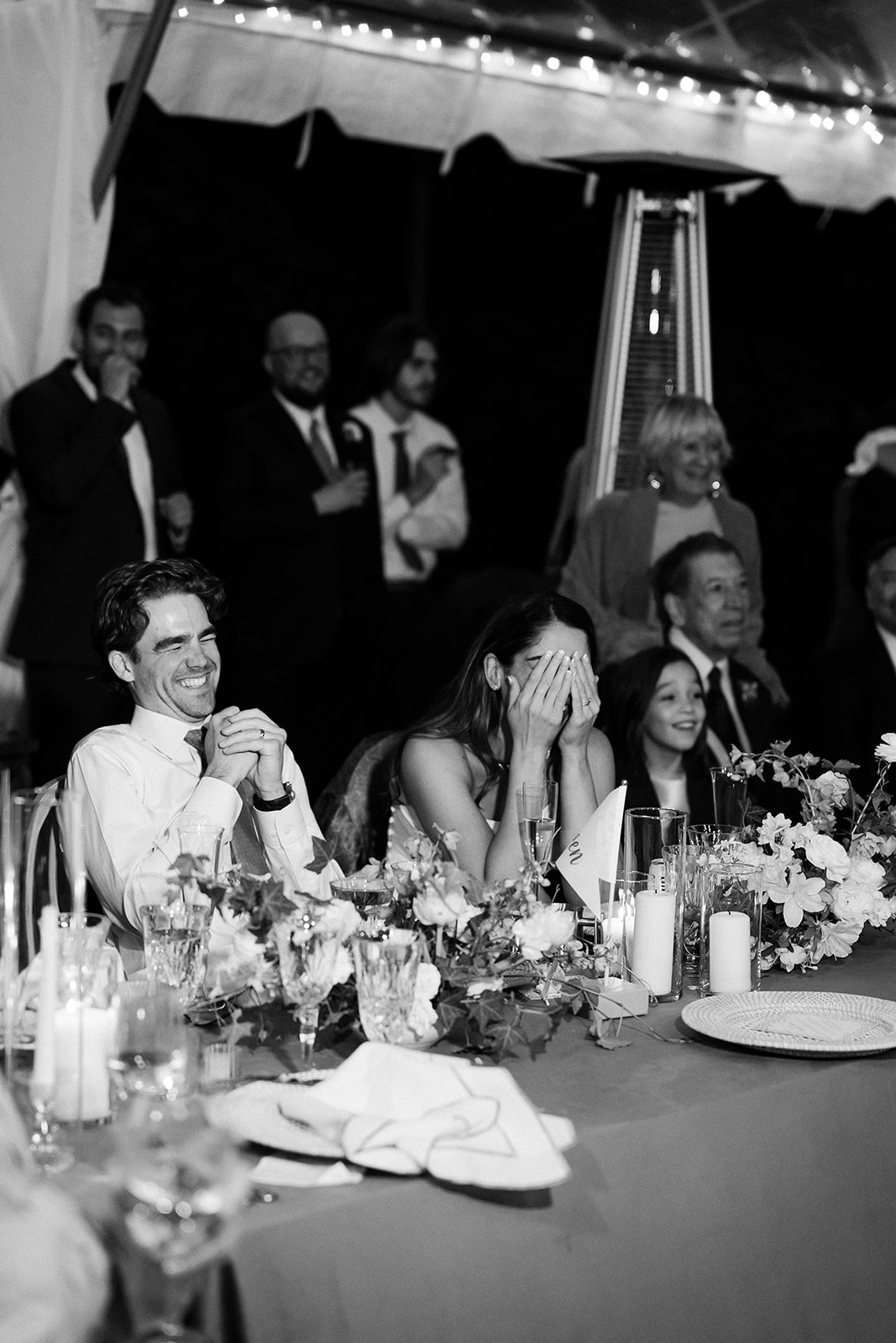 bride and groom laugh during wedding speeches. elegant south carolina spring wedding. sarah bradshaw photography