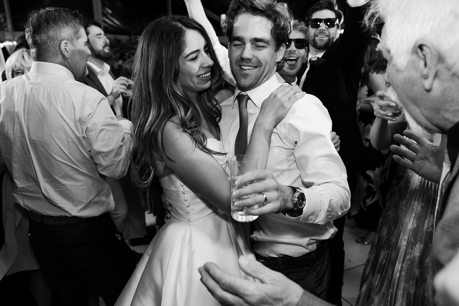 bride and groom candid dancing photo in wedding tent. elegant south carolina spring wedding. sarah bradshaw photography