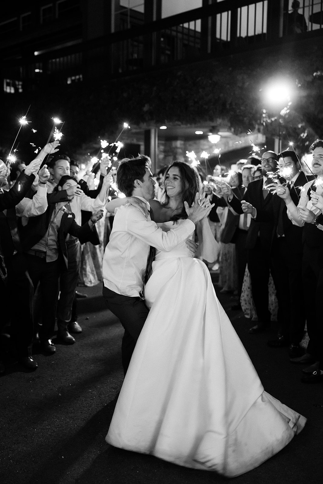 bride and groom dance during wedding sparkler exit. elegant south carolina spring wedding. sarah bradshaw photography