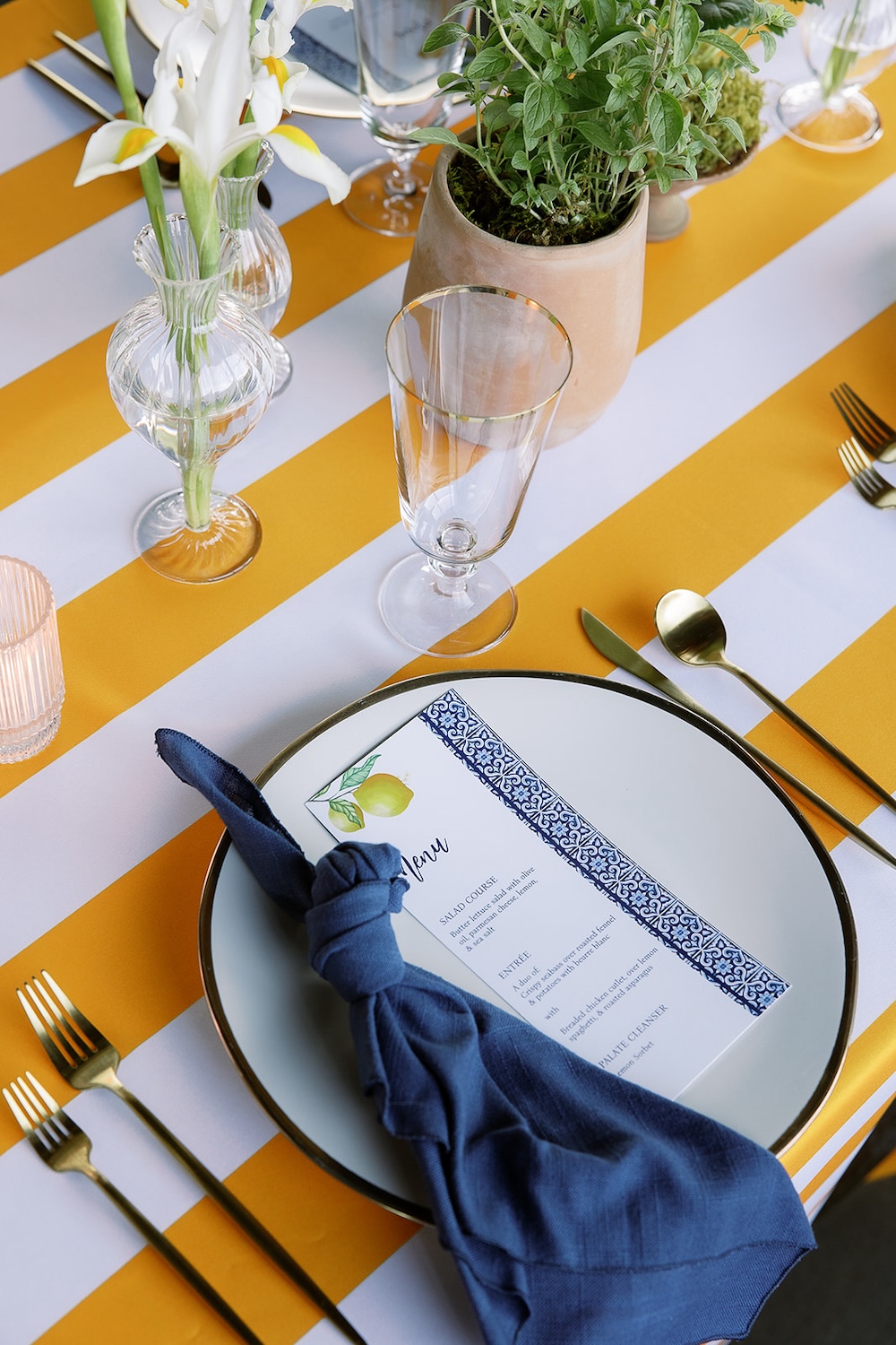 Lemon yellow and white stripe table linen. simple dinner placesetting, menu card with lemons.  Italian inspired wedding rehearsal dinner in Greenville, SC. Sarah Bradshaw Photography