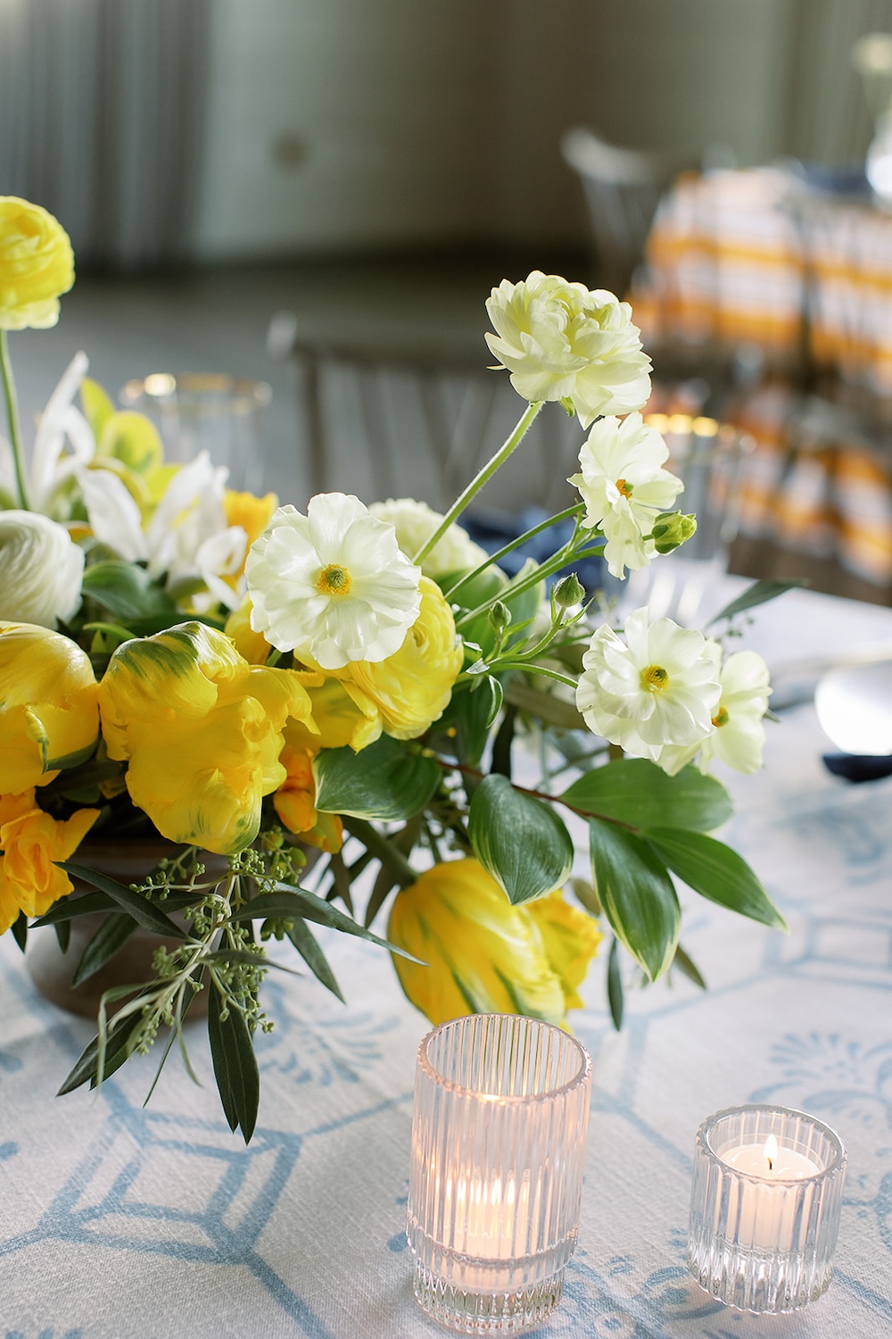 Organic shaped lush floral centerpiece, yellow and white.  Italian inspired wedding rehearsal dinner in Greenville, SC. Sarah Bradshaw Photography