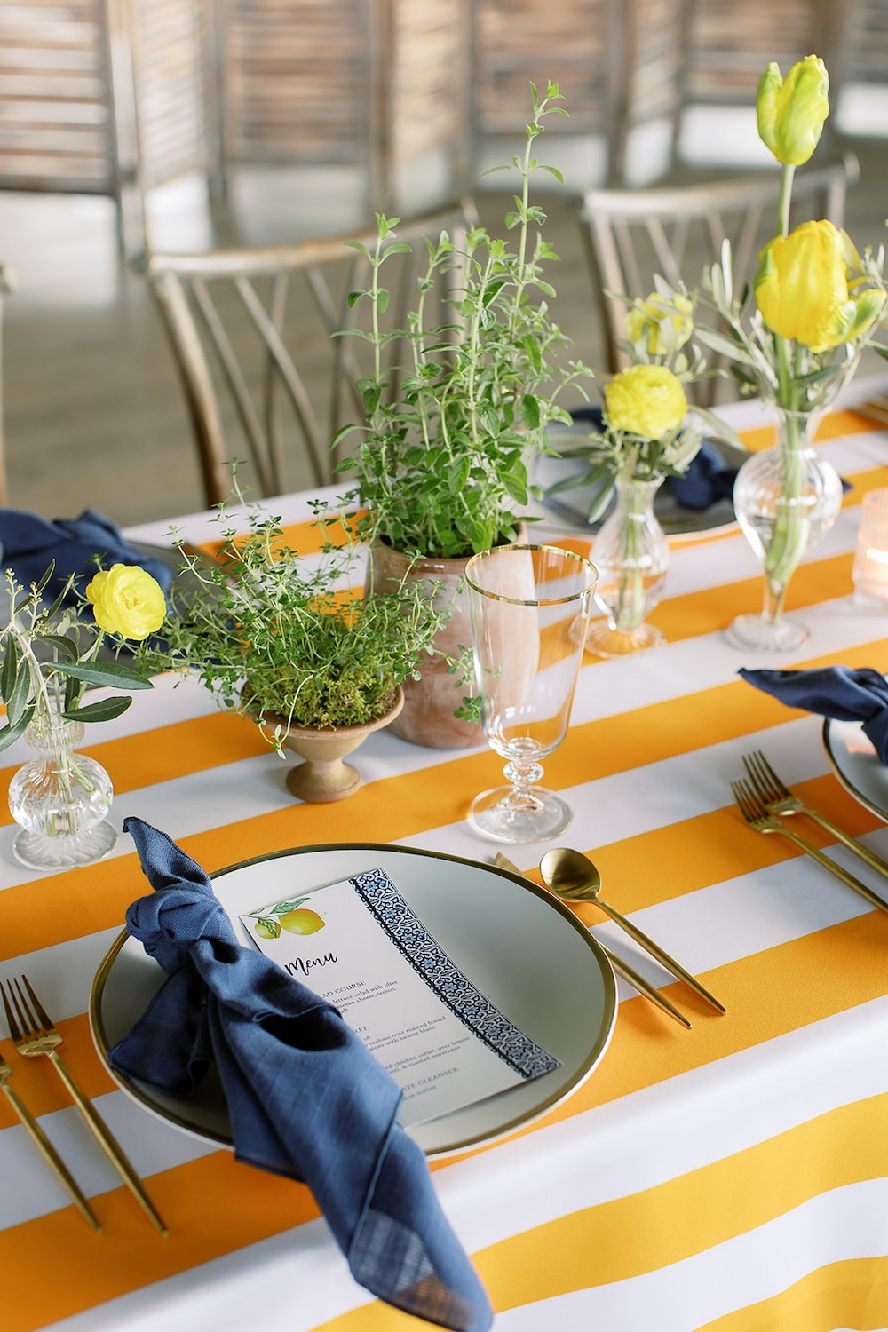 Herbs and yellow flowers centerpieces.  Italian inspired wedding rehearsal dinner in Greenville, SC. Sarah Bradshaw Photography