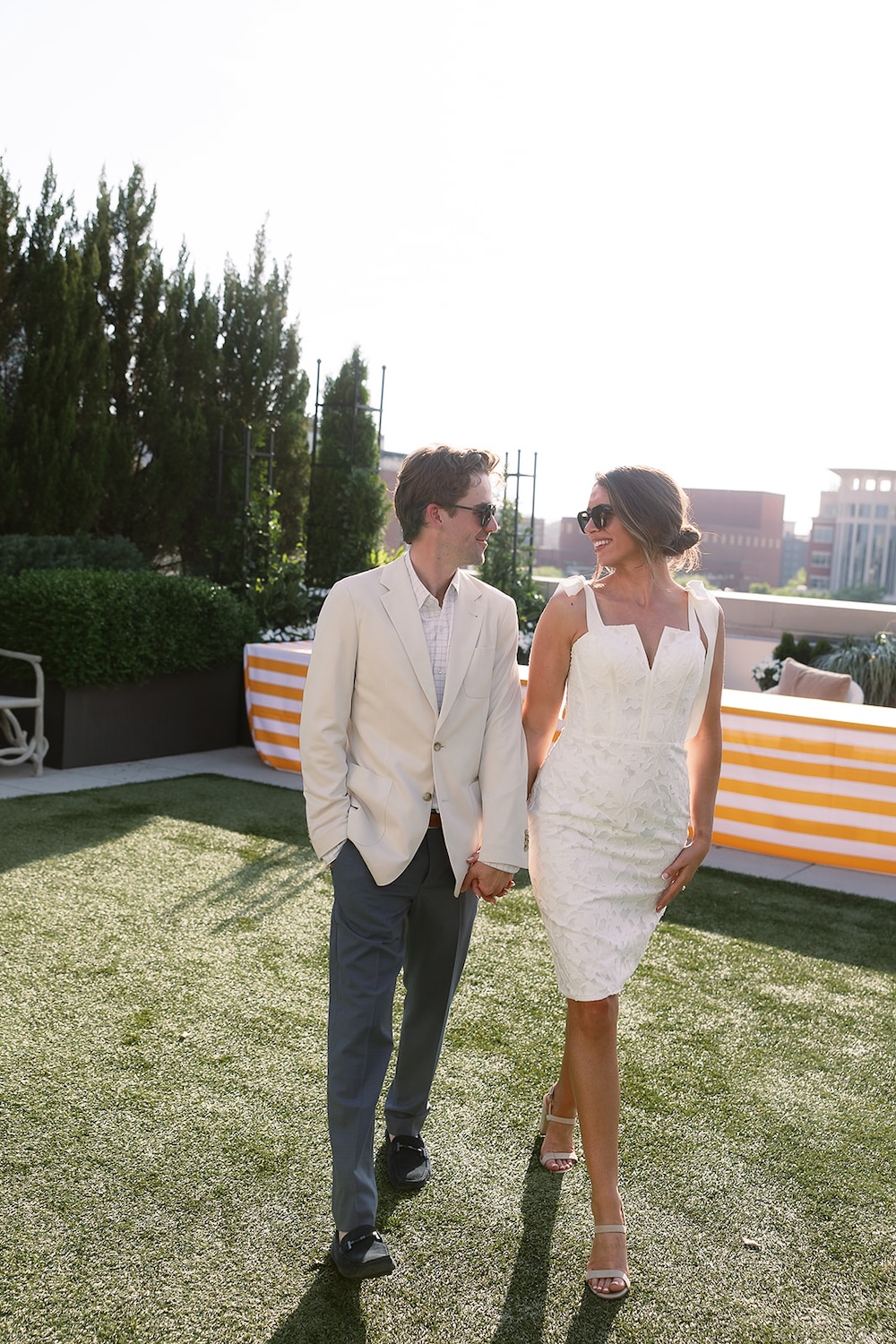 Portrait of bride and groom at rehearsal dinner on rooftop terrace.  Italian inspired wedding rehearsal dinner in Greenville, SC. Sarah Bradshaw Photography