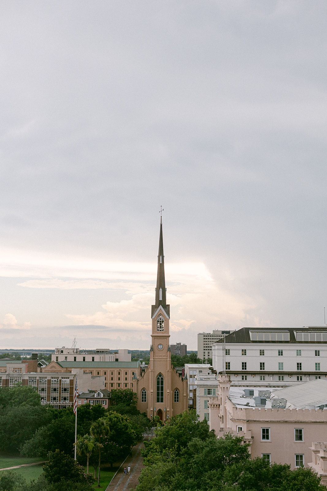 View of church steeple from rooftop terrace at luxury hotel. The Dewberry Hotel, Charleston South Carolina. Sarah Bradshaw Photography