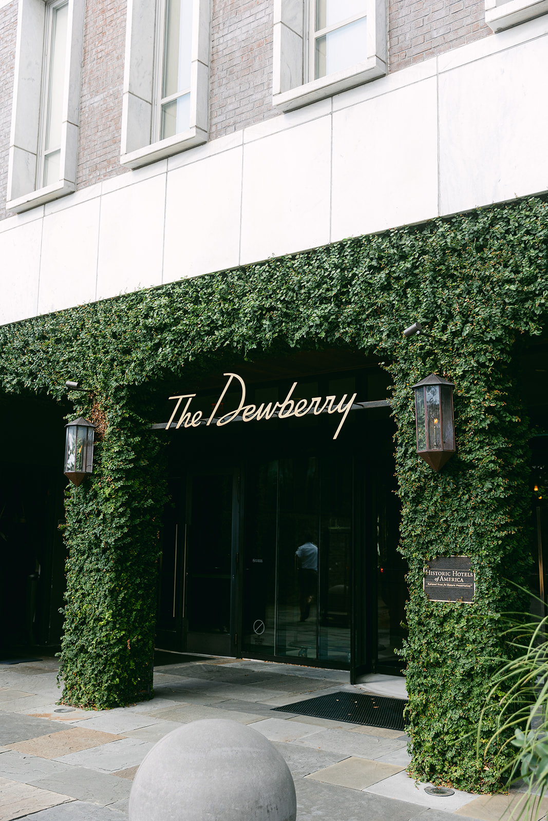 Ivy covered walls at entrance to luxury hotel. The Dewberry Hotel, Charleston South Carolina. Sarah Bradshaw Photography