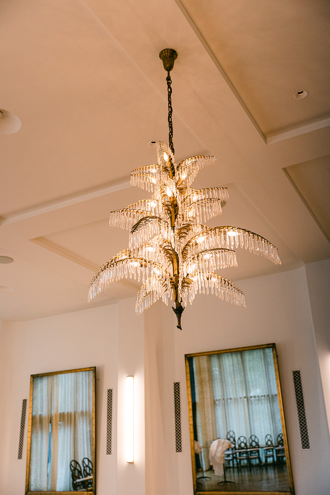 Elegant crystal chandelier in luxury hotel lobby. The Dewberry Hotel, Charleston South Carolina. Sarah Bradshaw Photography