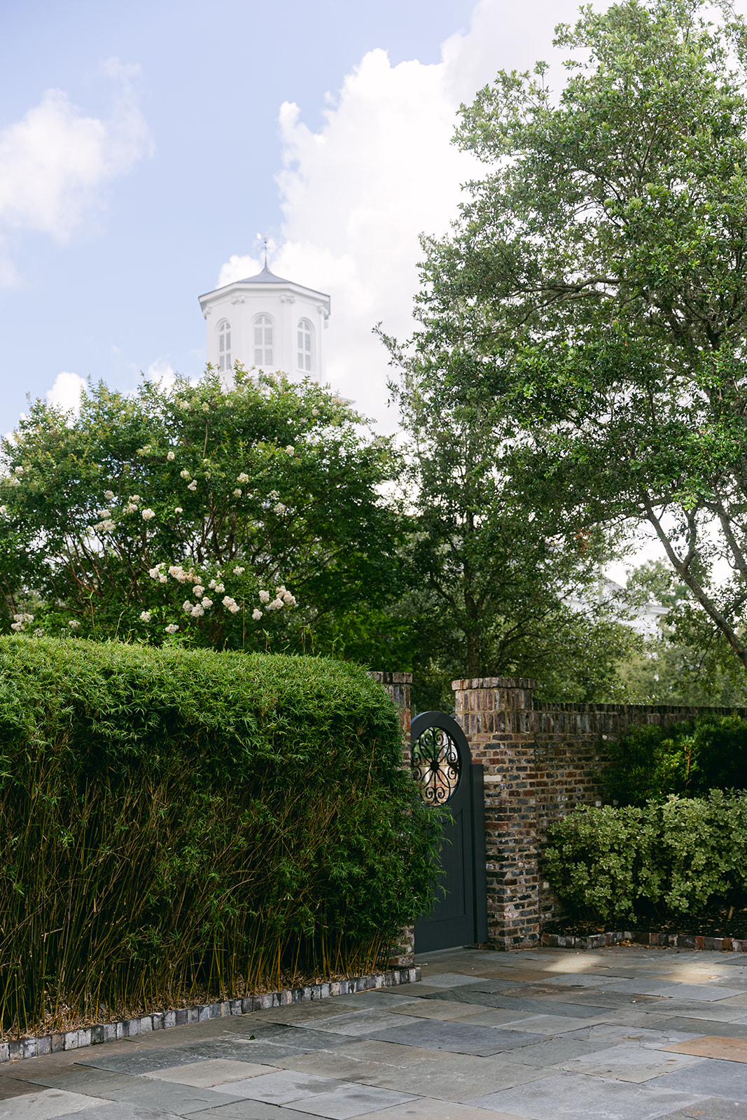 Walled garden patio space at luxury hotel. The Dewberry Hotel, Charleston South Carolina. Sarah Bradshaw Photography