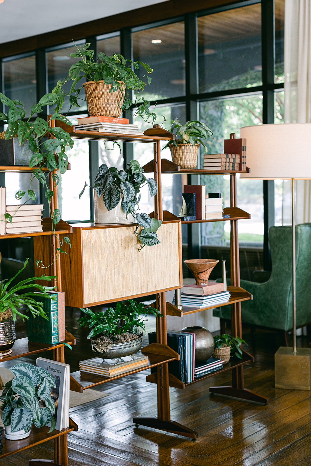 Chic hotel lobby decor shelving with live plants. The Dewberry Hotel, Charleston South Carolina. Sarah Bradshaw Photography