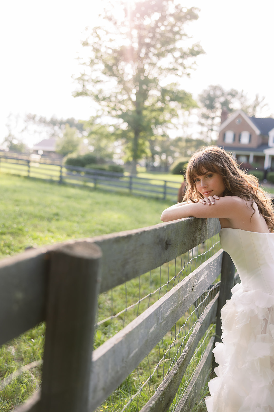 creative bridal portrait on horse farm. chic equestrian wedding inspiration at Red Fox Inn, Middleburg Virginia. Sarah Bradshaw