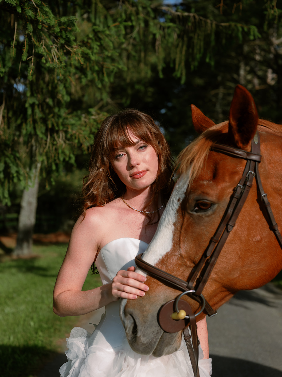 bride in strapless wedding dress, portrait with horse. chic equestrian wedding inspiration at Red Fox Inn, Middleburg Virginia. Sarah Bradshaw