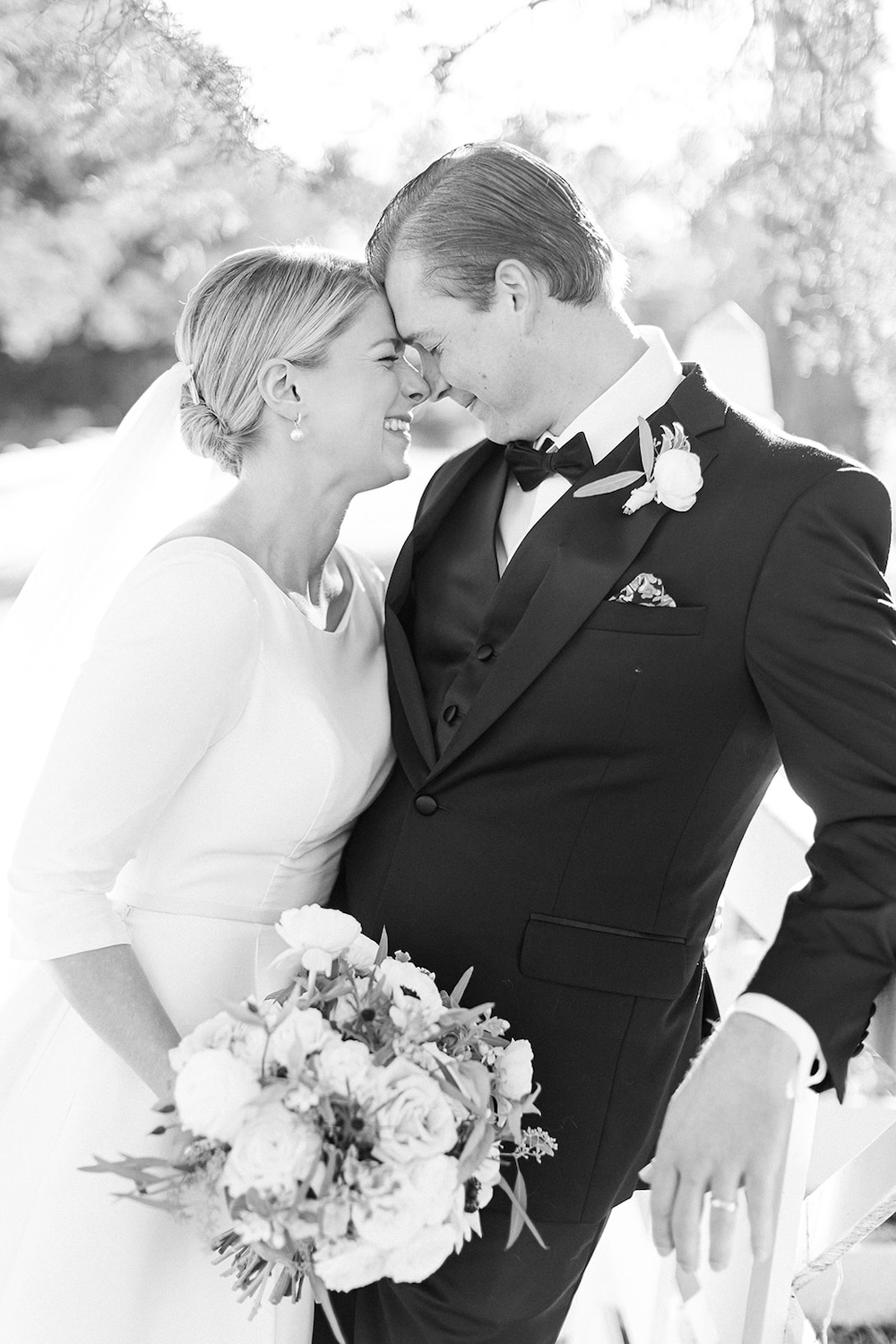 black and white portrait of bride and groom smiling and touching noses. Classic timeless winter wedding, woodlawn manor, alexandria va. Sarah bradshaw photography