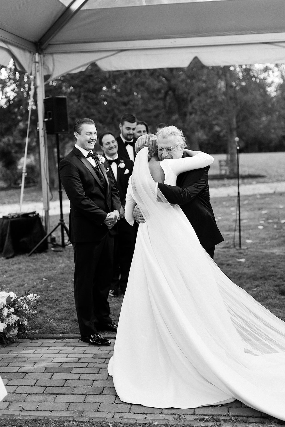 bride hugs father after walking down the aisle. Classic timeless winter wedding, woodlawn manor, alexandria va. Sarah bradshaw photography