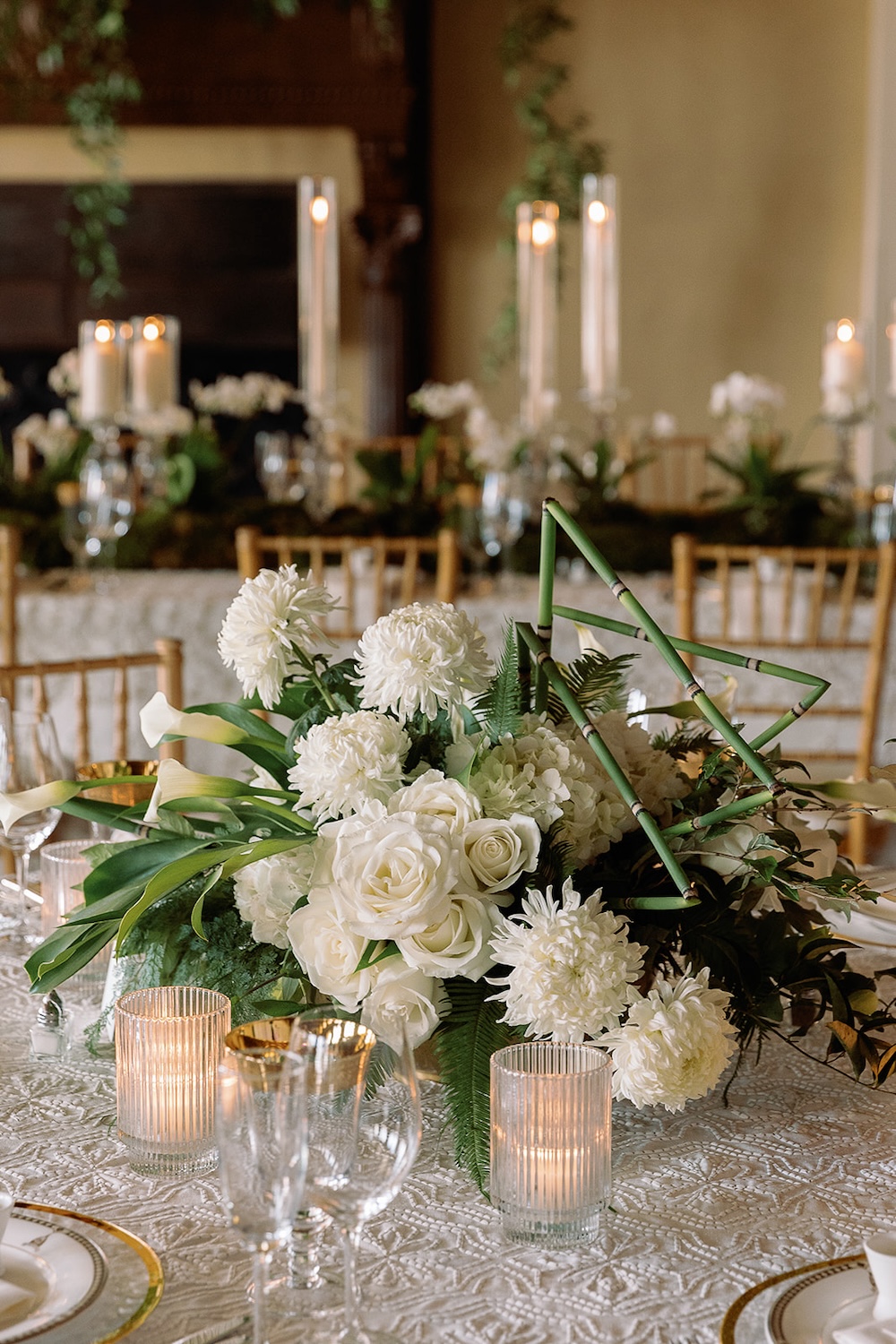 low, lush floral centerpiece. ferns, white roses, calla lilies, bamboo accents. Modern Luxe Washington DC wedding, Sarah Bradshaw Photography