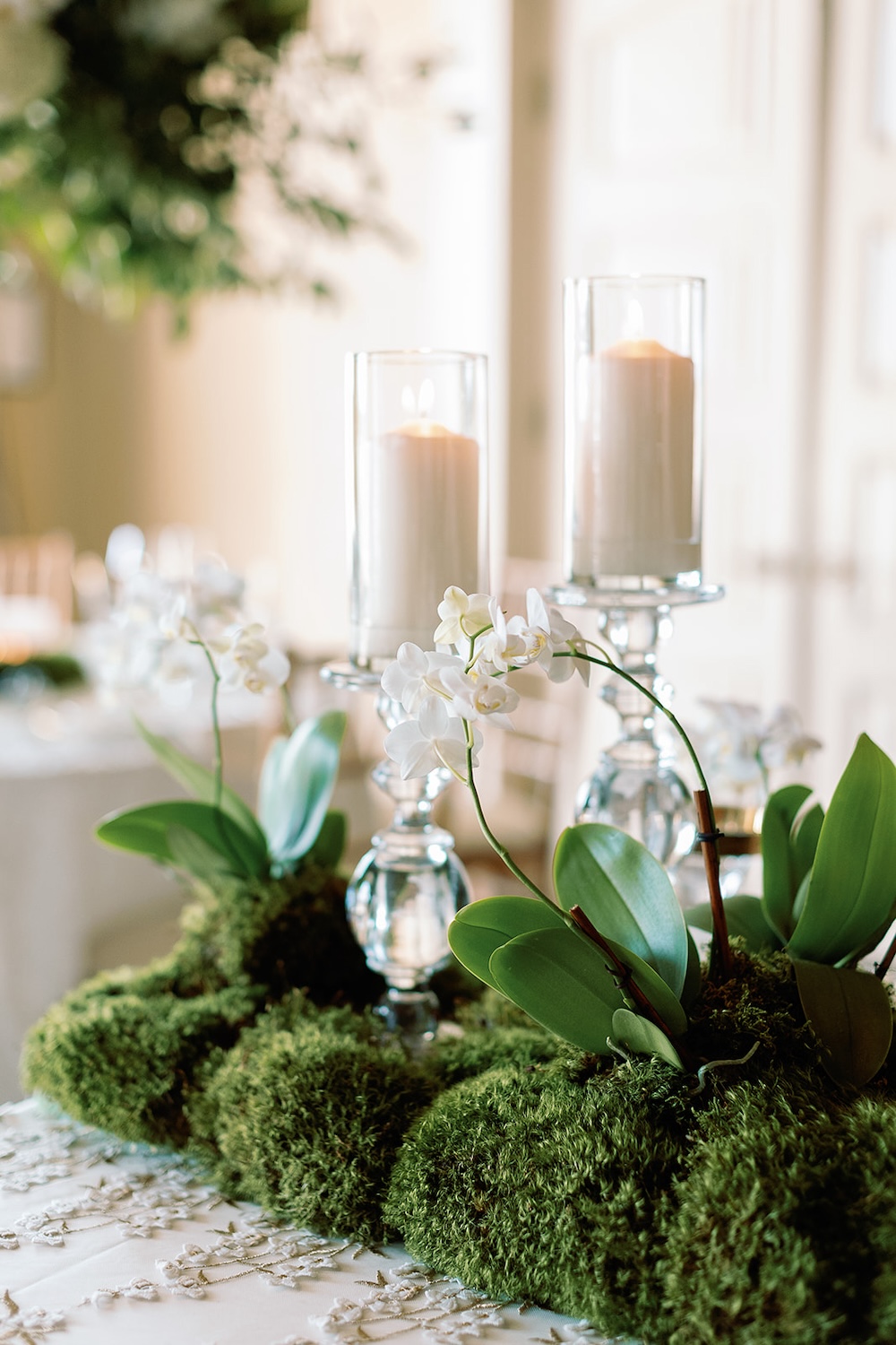 simple wedding centerpiece, moss table runner, white candles, white orchids. Modern Luxe Washington DC wedding, Sarah Bradshaw Photography