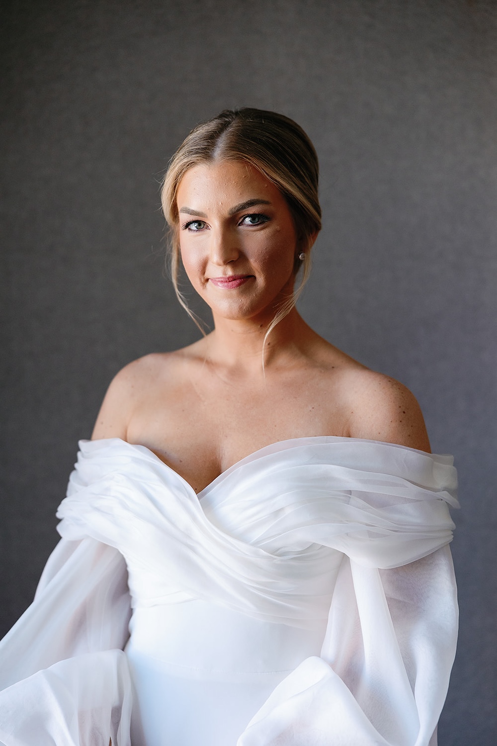 classic bridal portrait, ruched bodice designer wedding dress. off shoulders long sleeves. High end hotel ballroom wedding, The Fairmont, Washington DC. Sarah Bradshaw Photography