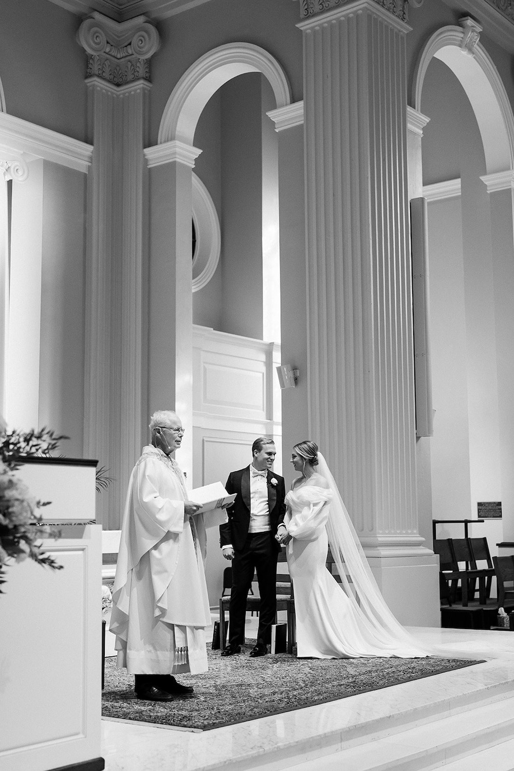 bride and groom stand at wedding alter. High end hotel ballroom wedding, The Fairmont, Washington DC. Sarah Bradshaw Photography