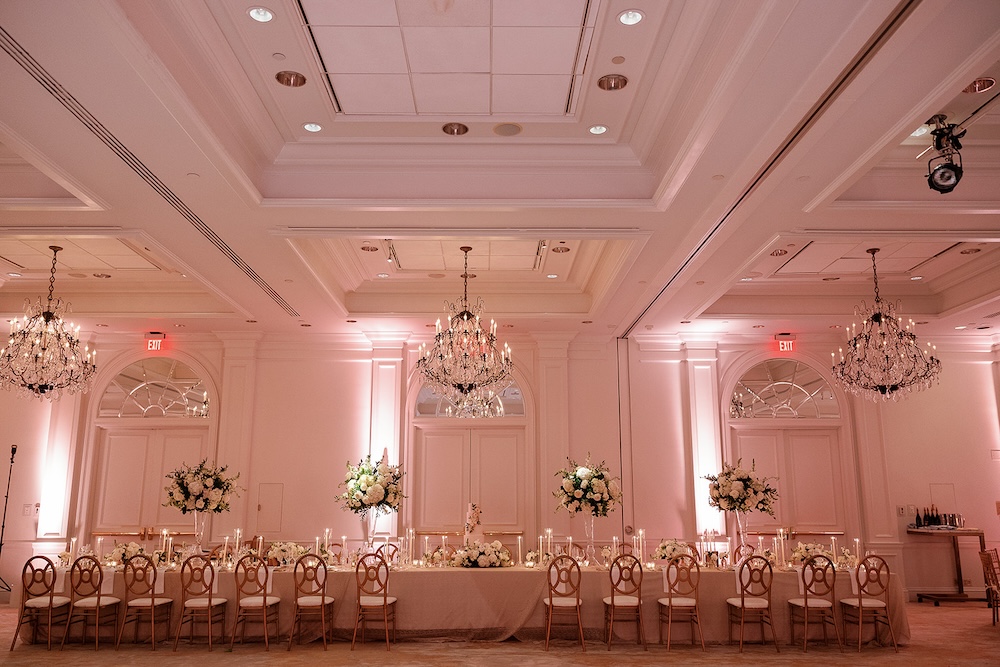 modern elegant wedding reception decor, tall lush centerpieces, crystal chandeliers. High end hotel ballroom wedding, The Fairmont, Washington DC. Sarah Bradshaw Photography