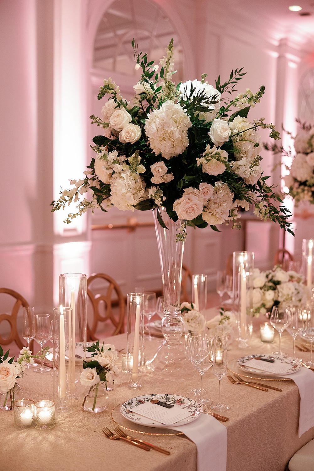 tall lush centerpiece with white roses and white hydrangeas. High end hotel ballroom wedding, The Fairmont, Washington DC. Sarah Bradshaw Photography