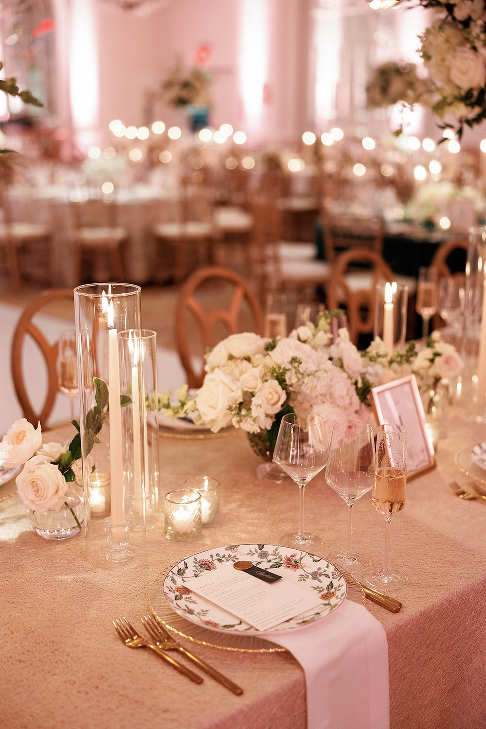 romantic wedding tablescape, white florals, candlelight, floral patterned china. High end hotel ballroom wedding, The Fairmont, Washington DC. Sarah Bradshaw Photography