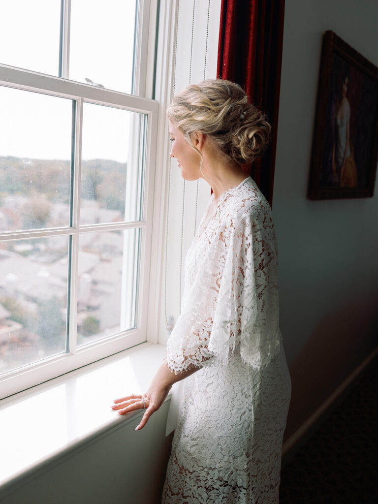 bride in lace robe at Historic Cavalier Hotel in Virginia Beach by Sarah Bradshaw Photography