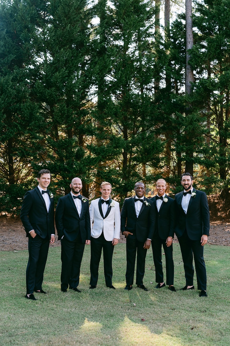 Traditional groomsmen portrait, black tuxedos. Elegant wedding at the Ritz-Carlton Lake Oconee in Georgia. Sarah Bradshaw Photography.