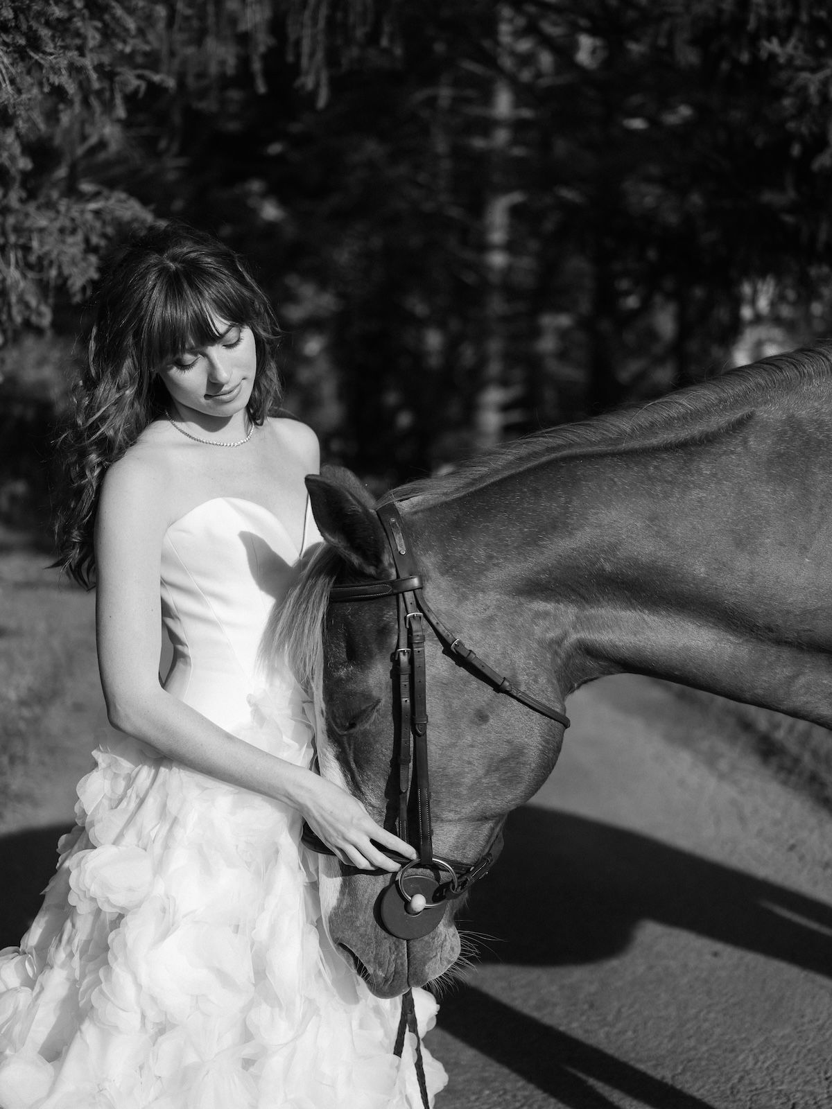 black and white portrait of bride with horse. chic equestrian wedding inspiration at Red Fox Inn, Middleburg Virginia. Sarah Bradshaw