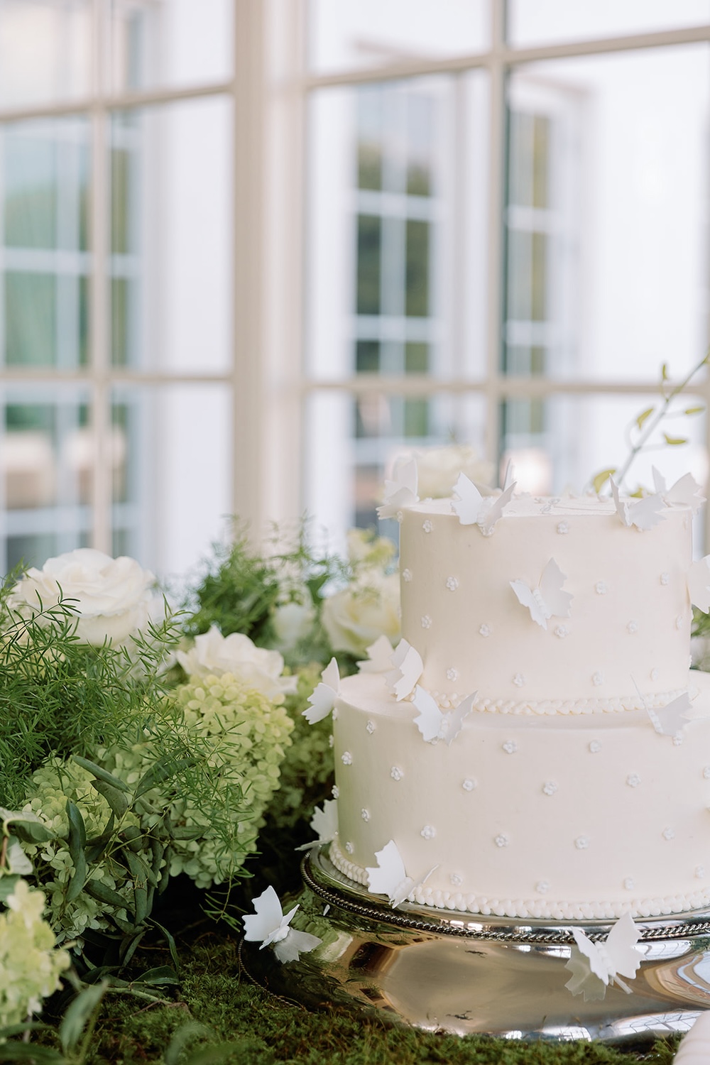 simple wedding cake with floral rosettes, butterfly accents. Modern Luxe Washington DC wedding, Sarah Bradshaw Photography