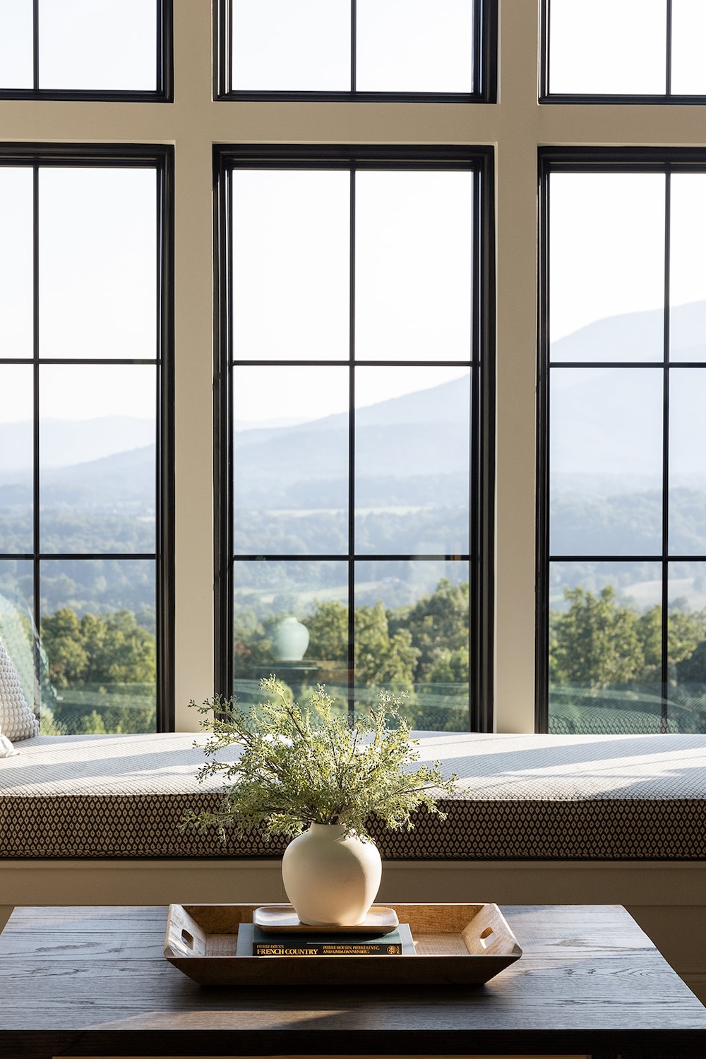 window bench seat overlooking mountains. Luxury rental property in blue ridge mountains, afton house, sarah bradshaw photography.