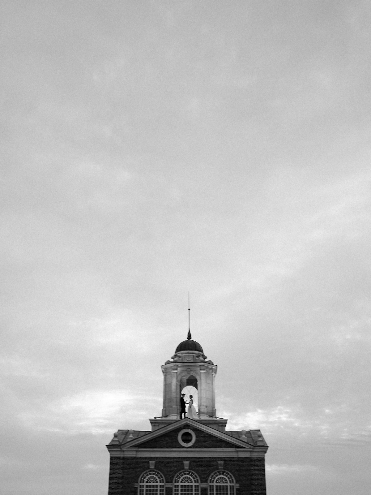 Bride & Groom bell tower drone portrait at Historic Cavalier Hotel in Virginia Beach by Sarah Bradshaw Photography