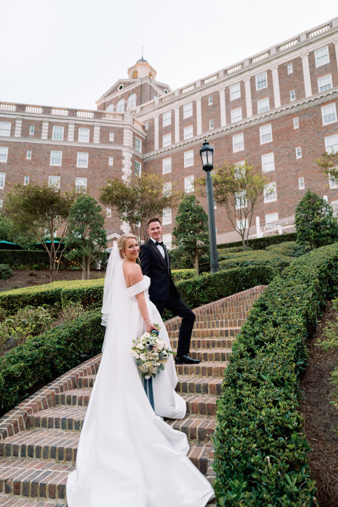 wedding portrait on staircase at Historic Cavalier Hotel in Virginia Beach by Sarah Bradshaw Photography