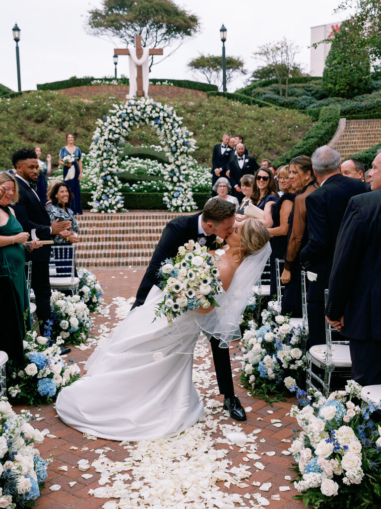Sunken Garden wedding ceremony aisle kiss at Historic Cavalier Hotel in Virginia Beach by Sarah Bradshaw Photography